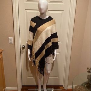 Black, Tan, cream striped fringe poncho.